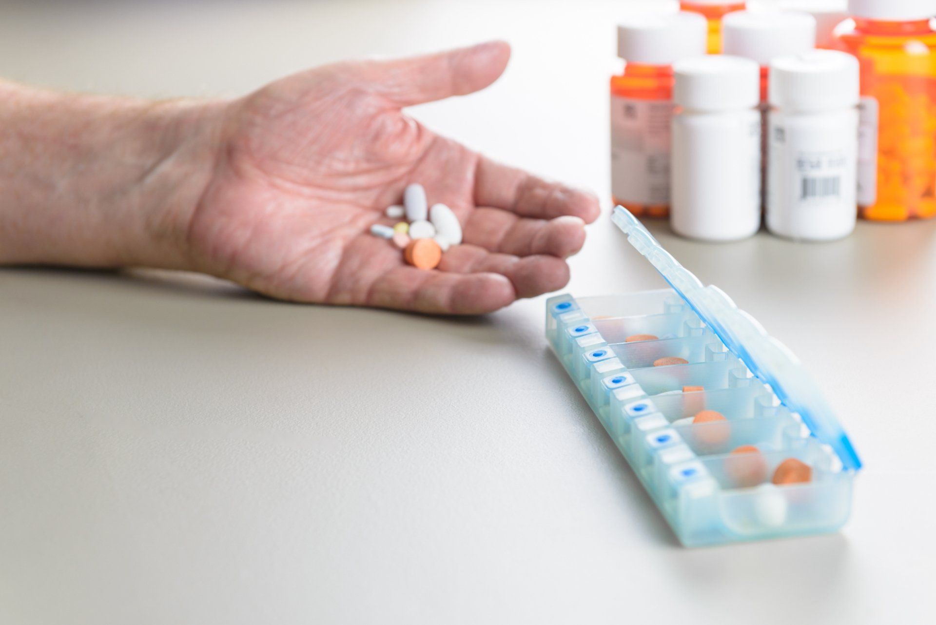Older adult sorting medication
