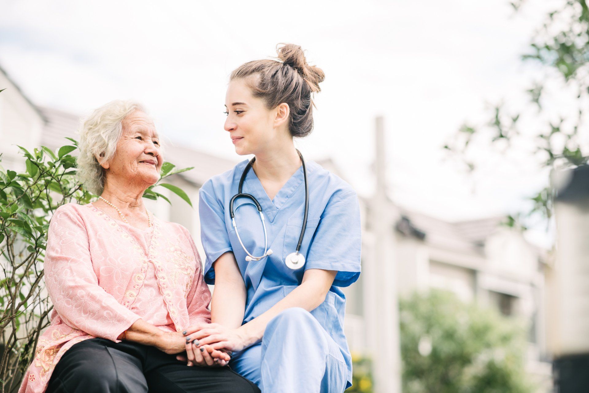 Nurse comforting an older woman